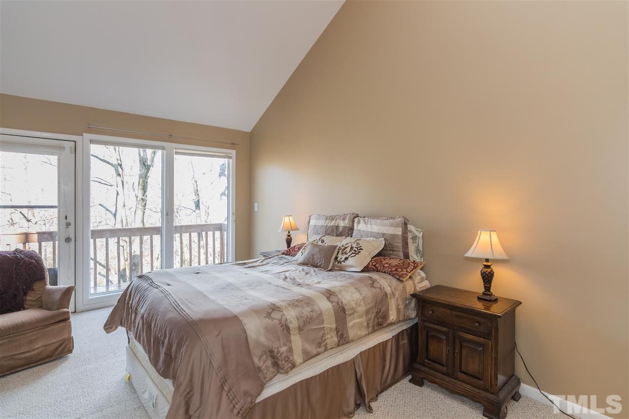 5 Sandstone Ridge Drive Durham, NC 27713 - Photo 19 of 25 a bedroom with a bed and a window