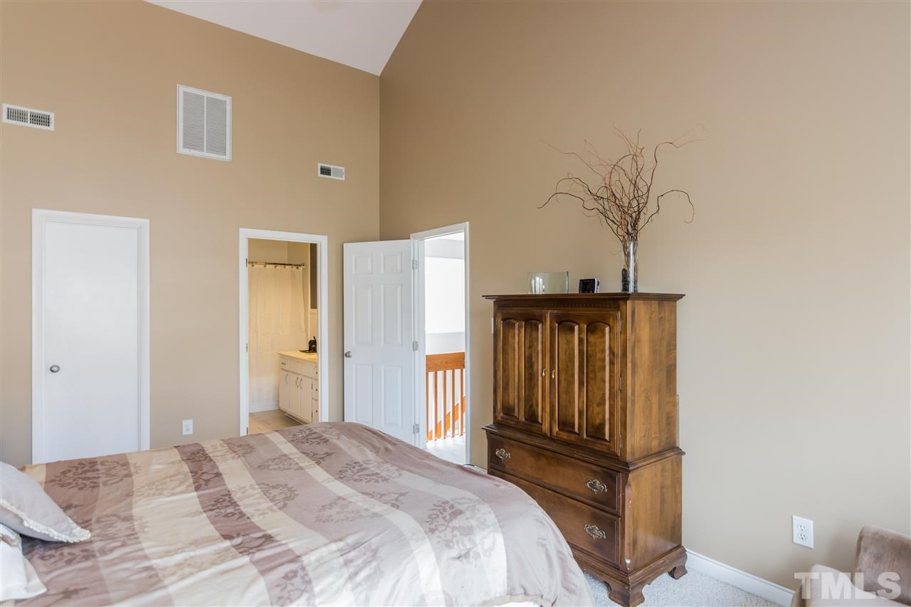 5 Sandstone Ridge Drive Durham, NC 27713 - Photo 20 of 25 a bedroom with a bed and a dresser