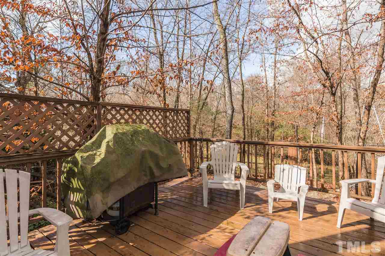 5 Sandstone Ridge Drive Durham, NC 27713 - Photo 23 of 25 a view of balcony with chairs and wooden fence