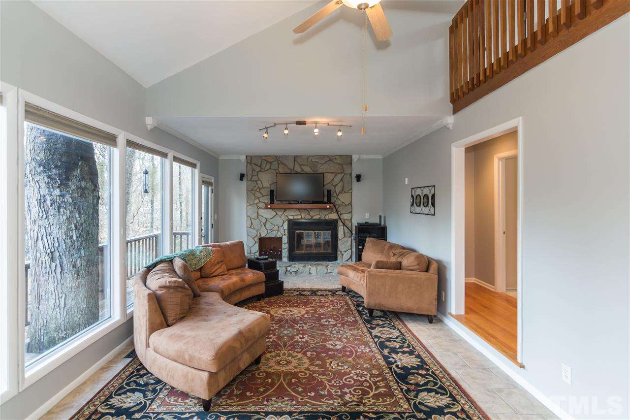 5 Sandstone Ridge Drive Durham, NC 27713 - Photo 6 of 25 a living room with furniture and a fireplace