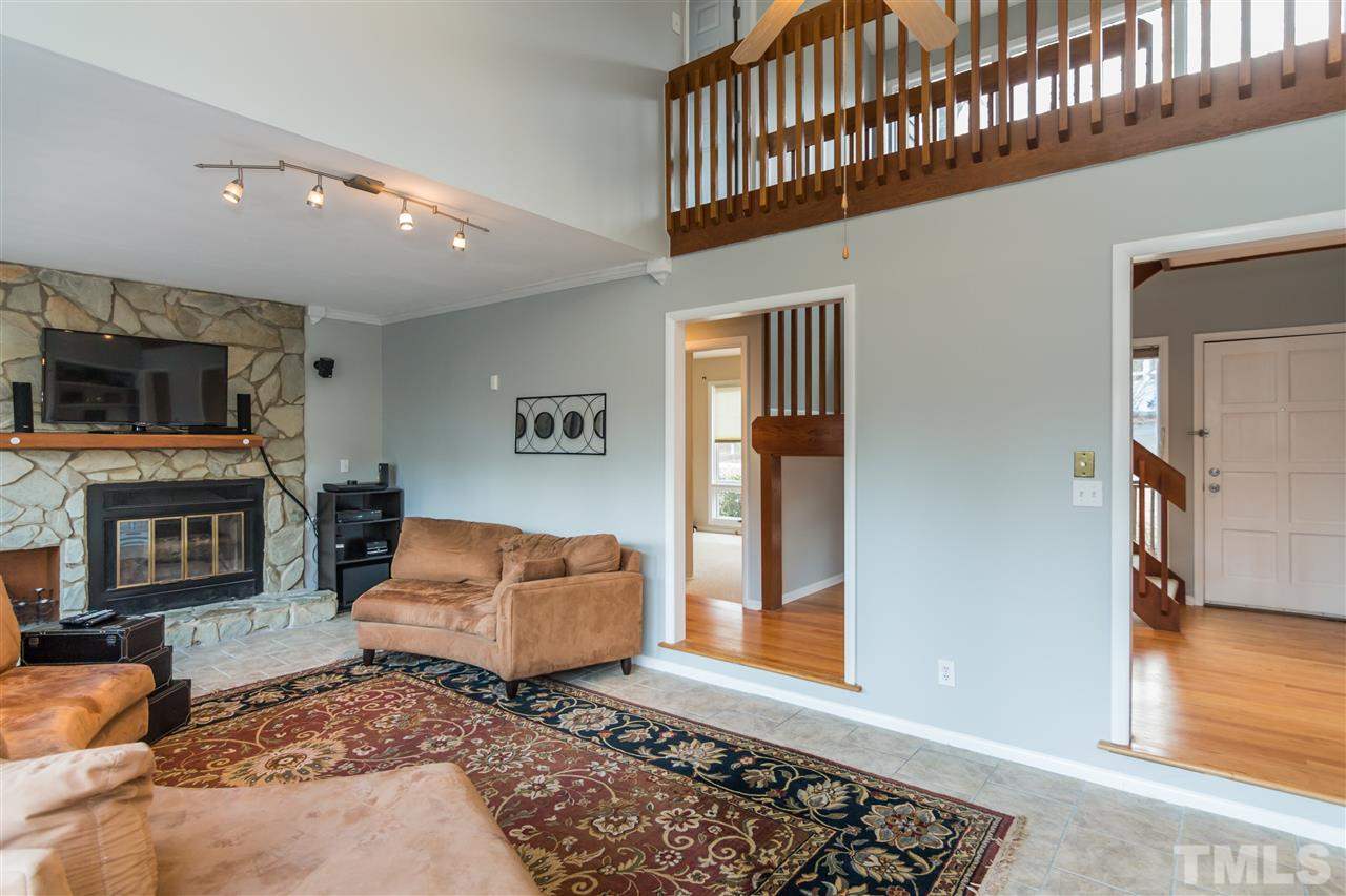 5 Sandstone Ridge Drive Durham, NC 27713 - Photo 7 of 25 a living room with furniture rug and wooden floor