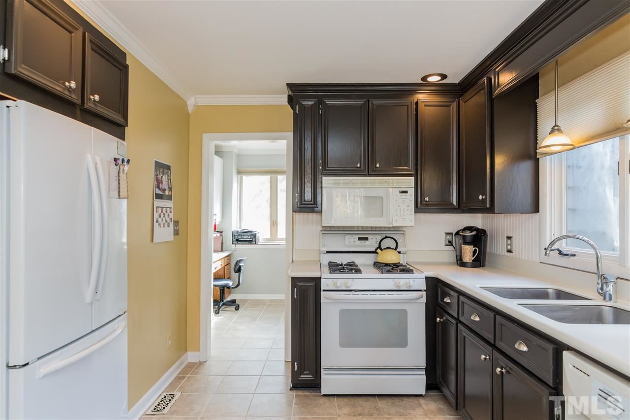 5 Sandstone Ridge Drive Durham, NC 27713 - Photo 10 of 25 a kitchen with a sink stove and refrigerator