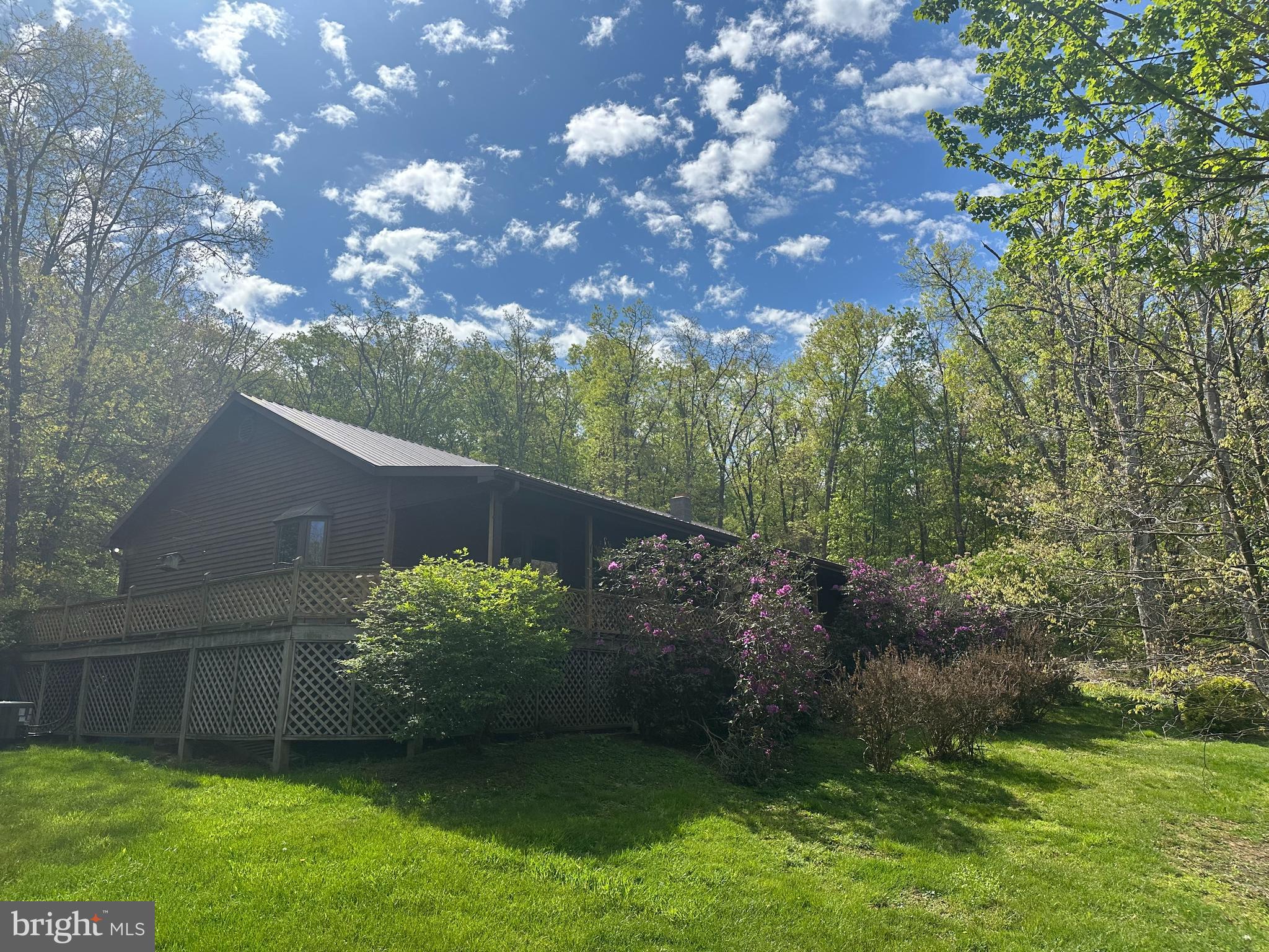 90 Shade Valley Road Rio, WV 26755 - Photo 1 of 41 a backyard of a house with lots of green space