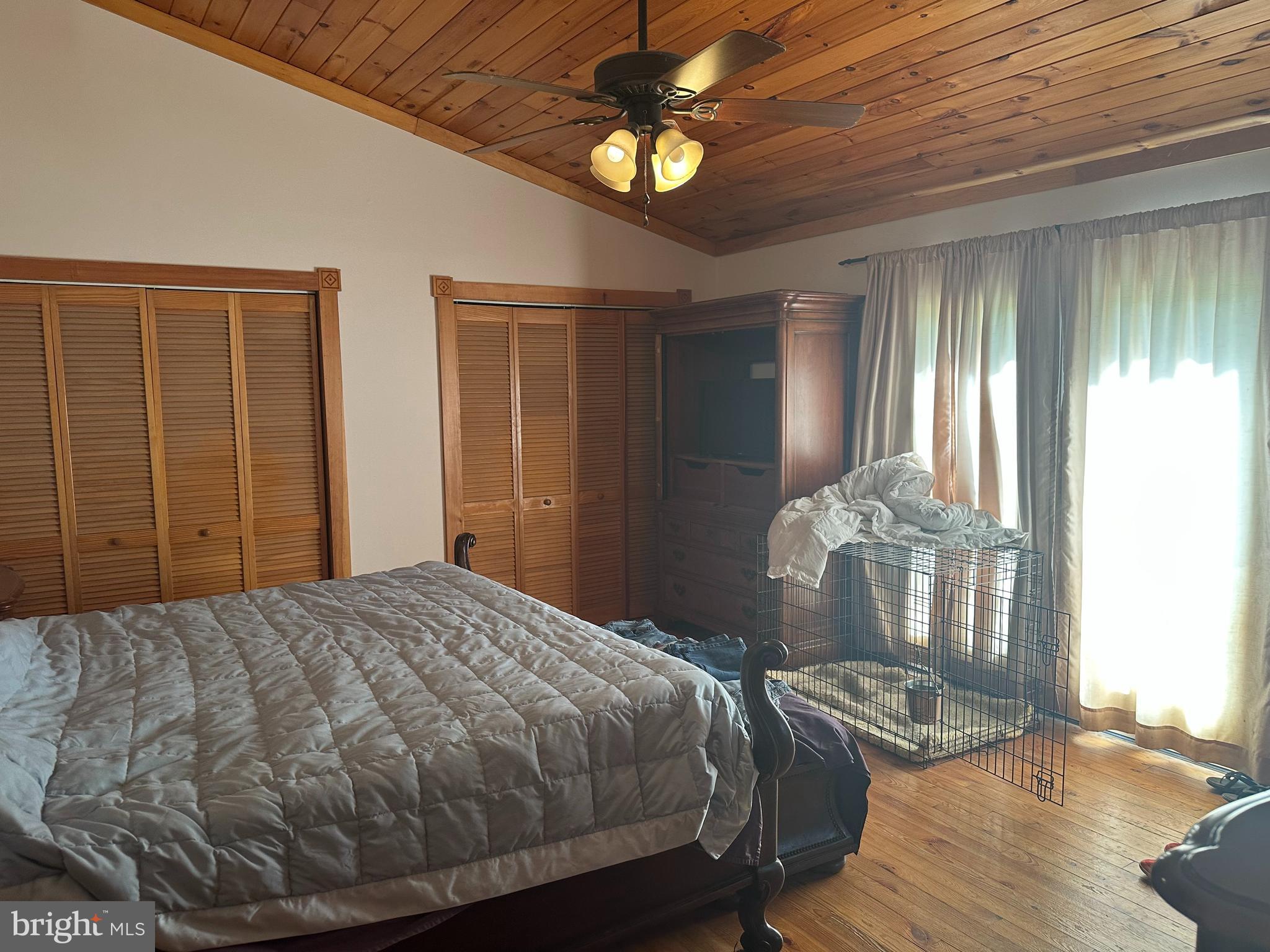 90 Shade Valley Road Rio, WV 26755 - Photo 18 of 41 a bedroom with a bed and wooden floor
