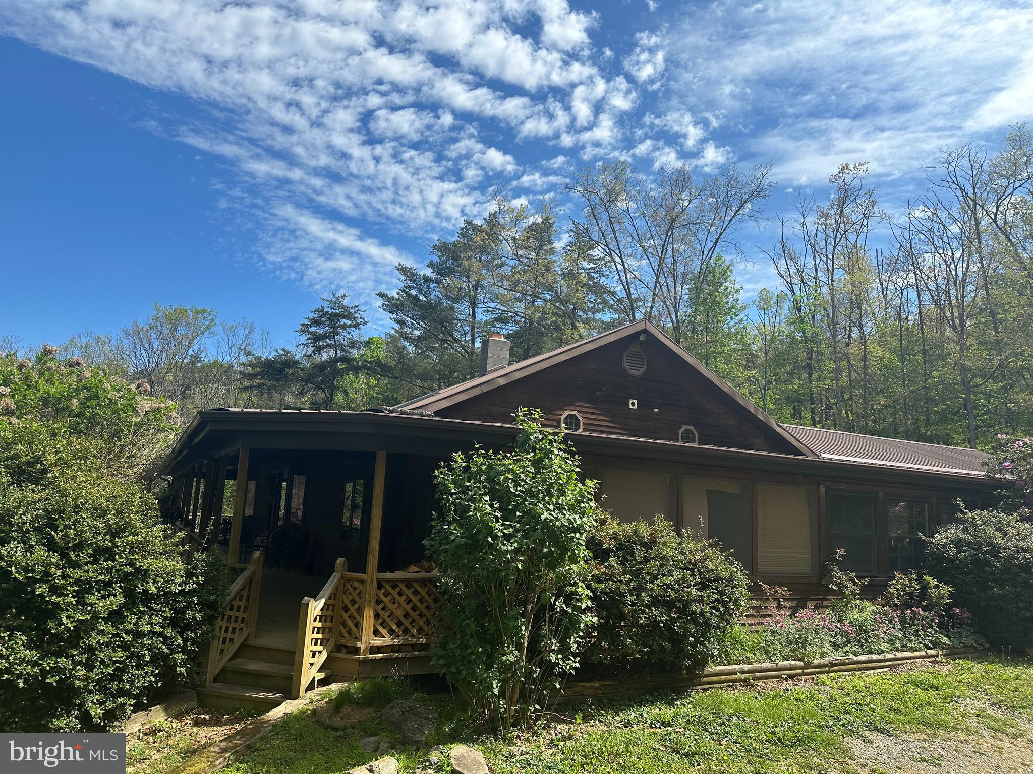90 Shade Valley Road Rio, WV 26755 - Photo 2 of 41 a front view of a house with garden