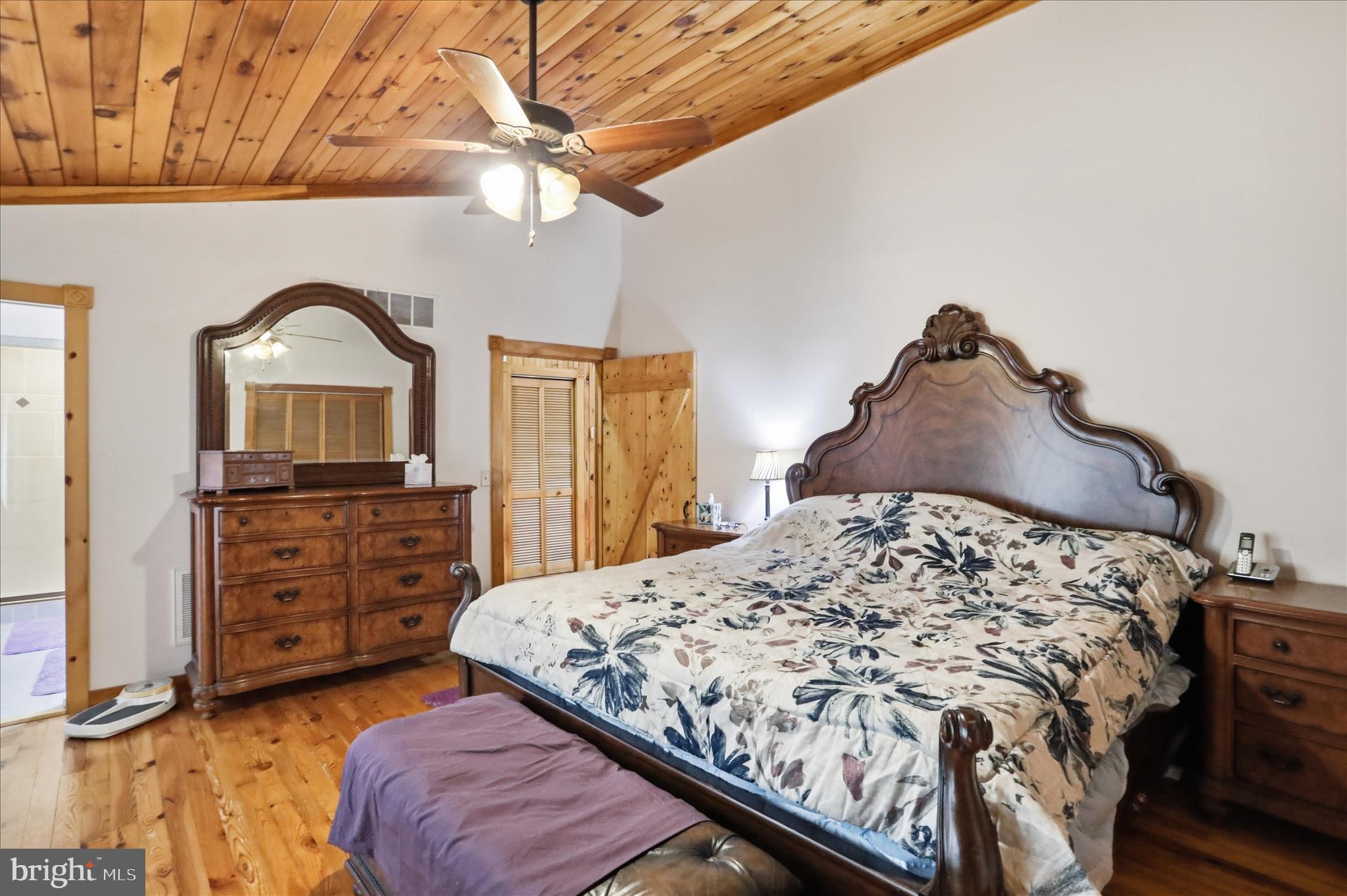 90 Shade Valley Road Rio, WV 26755 - Photo 22 of 41 a bedroom with a bed and a dresser