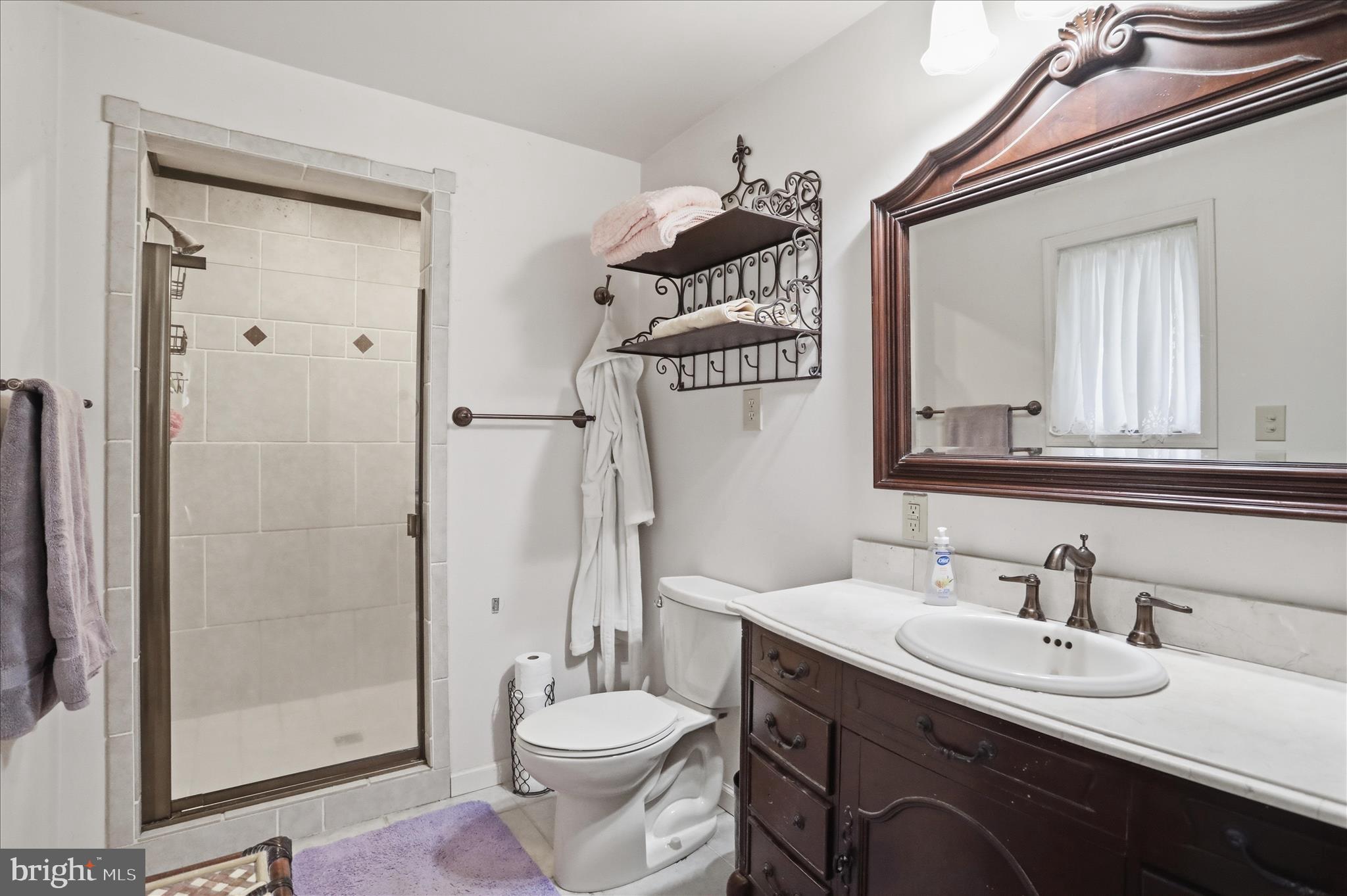 90 Shade Valley Road Rio, WV 26755 - Photo 25 of 41 a bathroom with a double vanity sink mirror and toilet