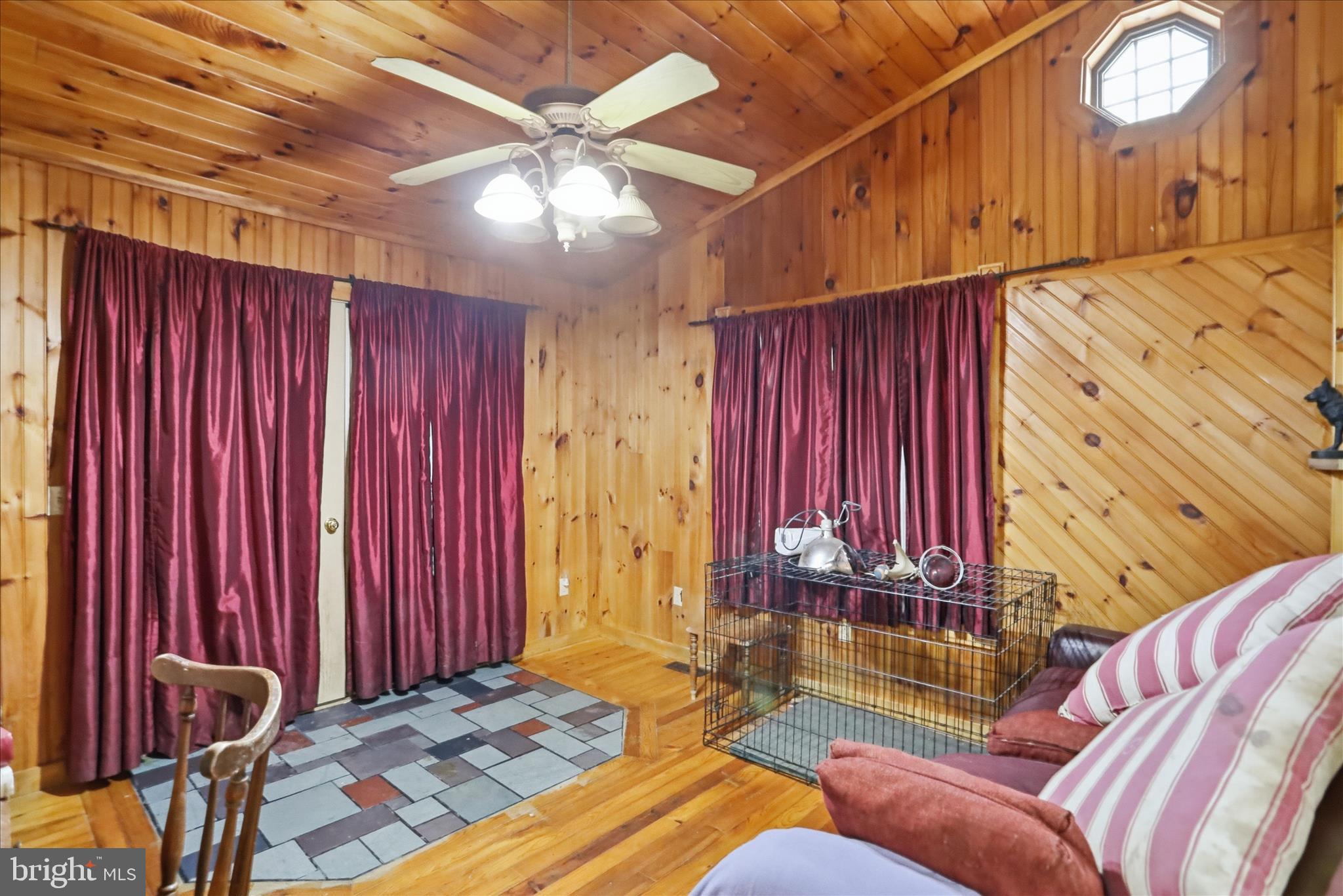 90 Shade Valley Road Rio, WV 26755 - Photo 30 of 41 a living room with furniture a chandelier and a dining table