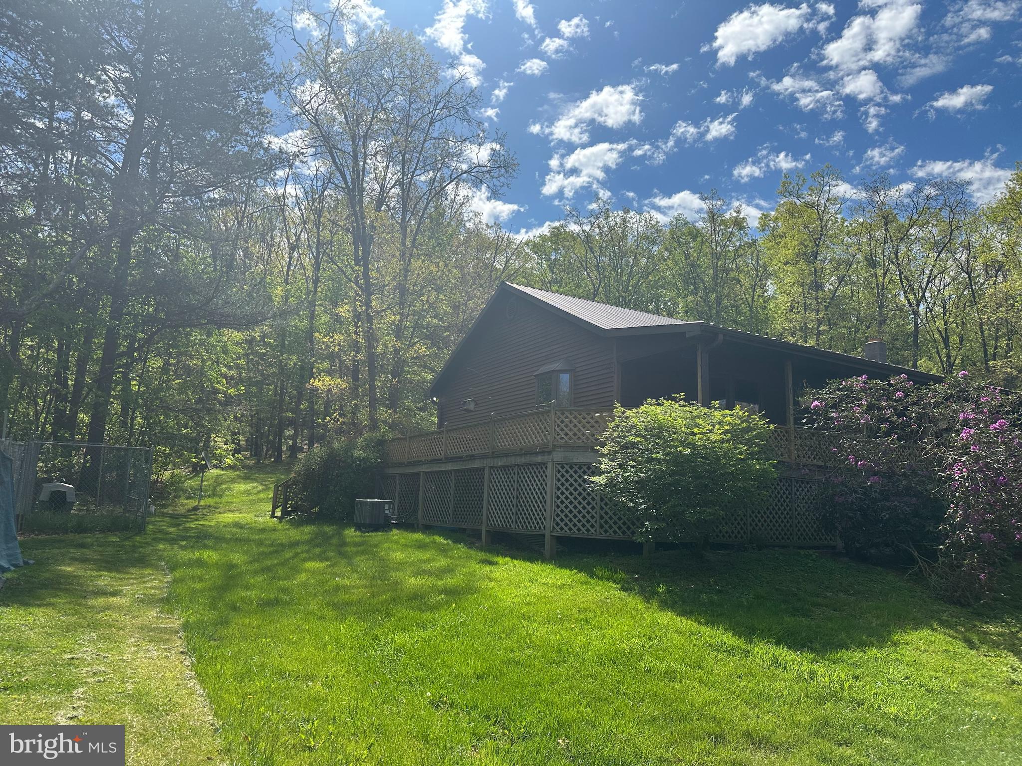 90 Shade Valley Road Rio, WV 26755 - Photo 3 of 41 a backyard of a house with lots of green space