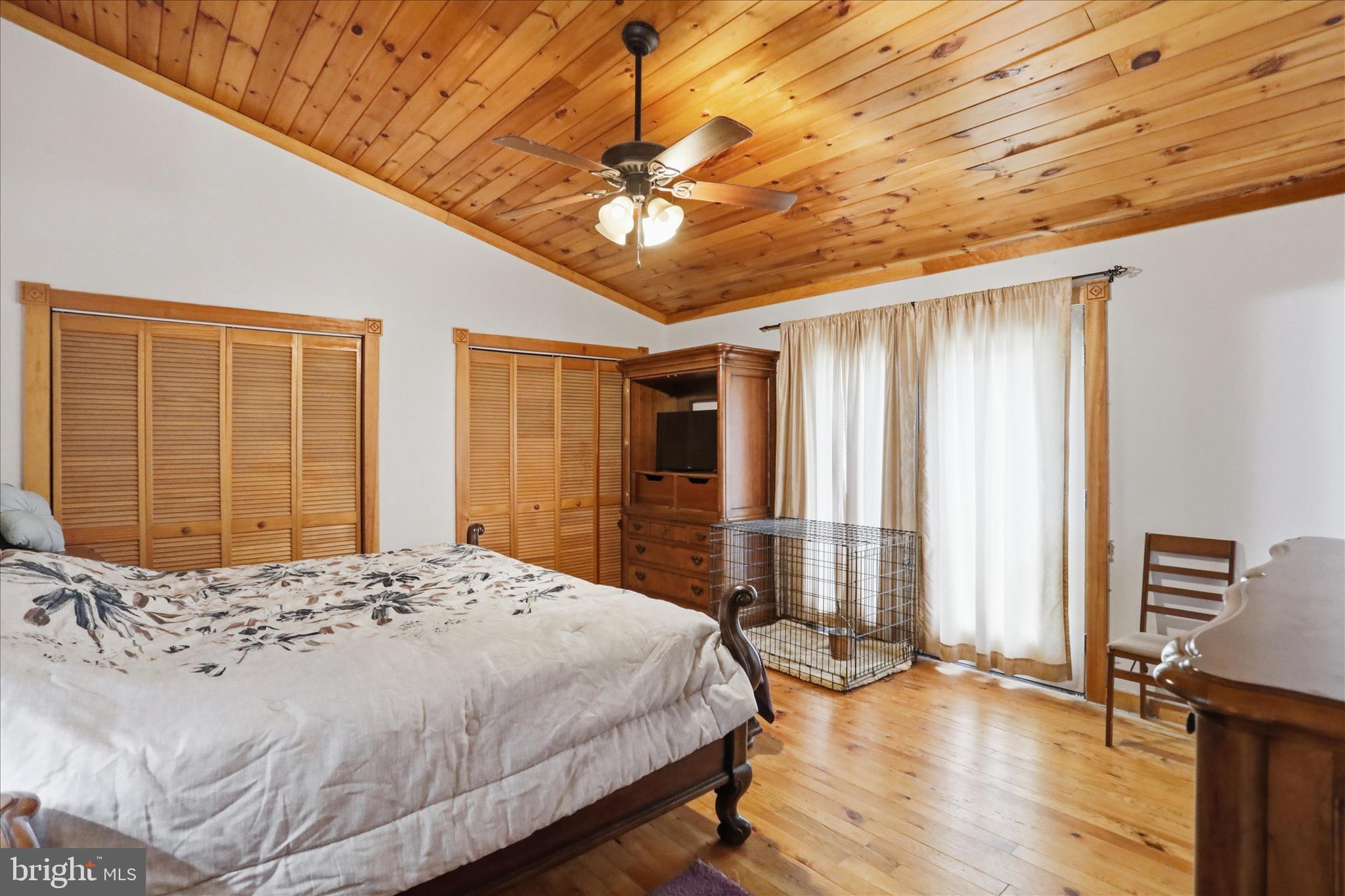 90 Shade Valley Road Rio, WV 26755 - Photo 32 of 41 a bedroom with a large bed and a dresser
