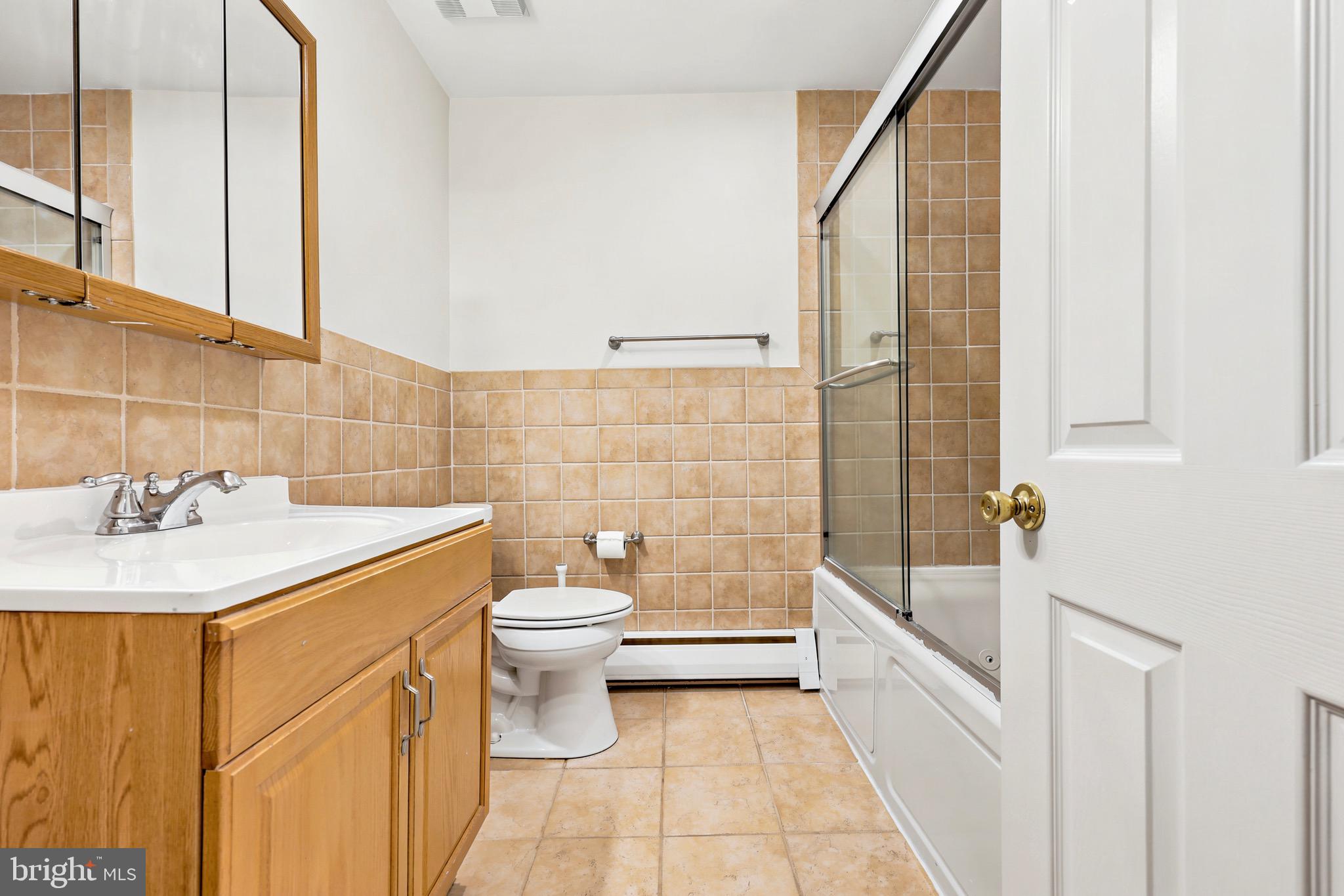 412 Yorkshire Road Bryn Mawr, PA 19010 - Photo 19 of 25 a bathroom with a sink a toilet and shower