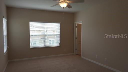 7652 Ripplepointe Way Windermere, FL 34786 - Photo 11 of 21 a view of an empty room with a window