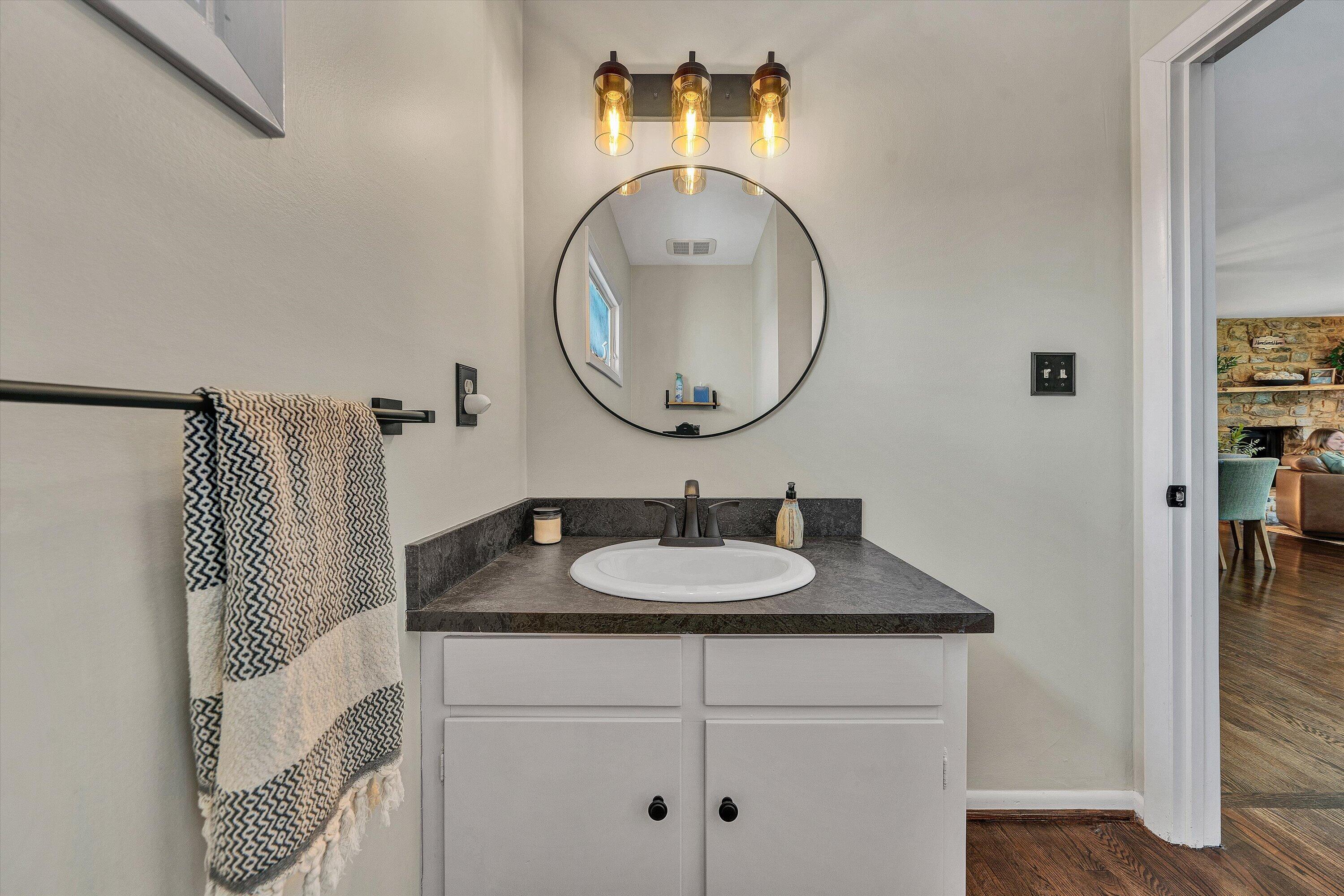 5157 Remington Road Roanoke, VA 24018 - Photo 16 of 63 a bathroom with a sink and a mirror
