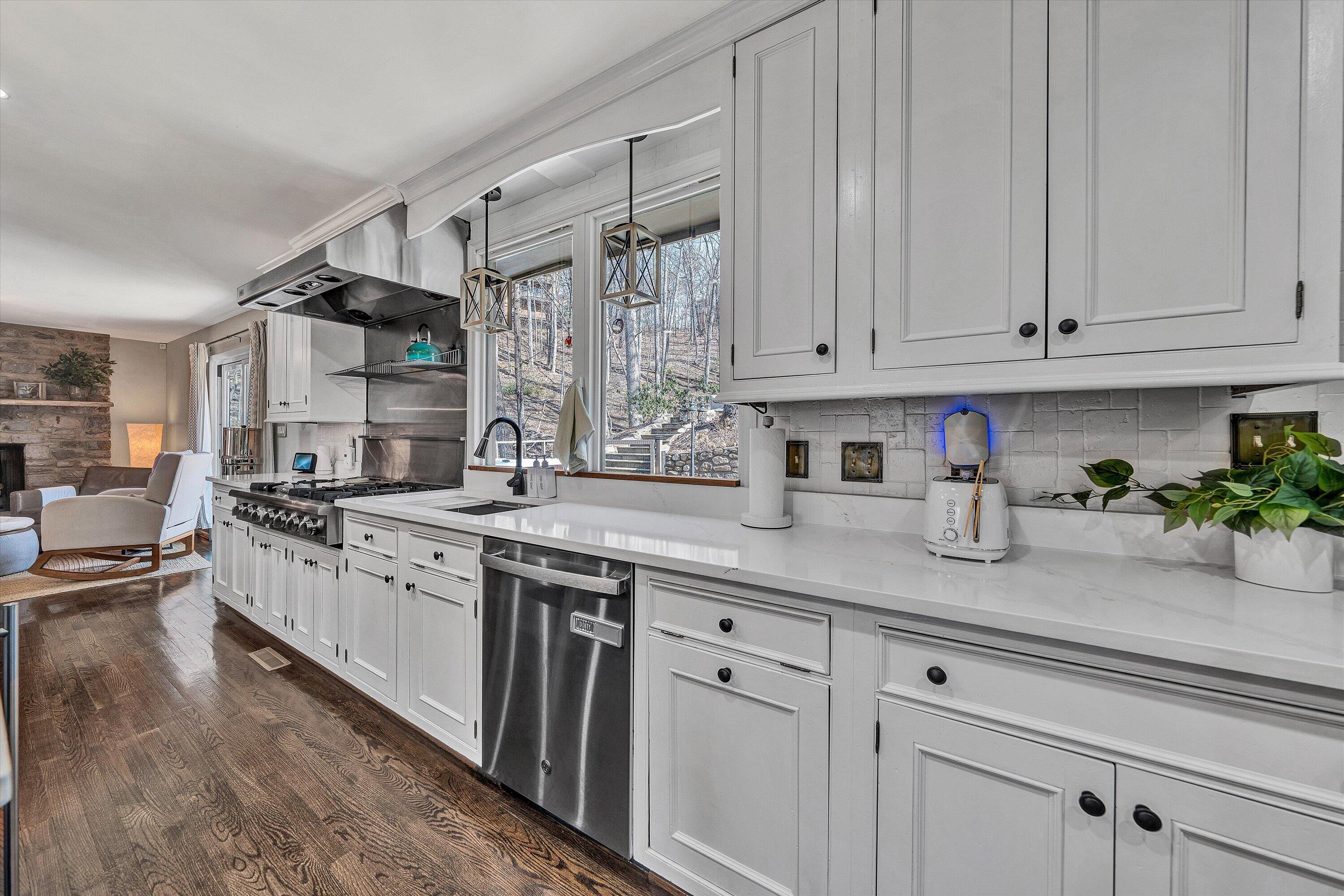 5157 Remington Road Roanoke, VA 24018 - Photo 18 of 63 a kitchen with stainless steel appliances granite countertop a sink a stove and cabinets
