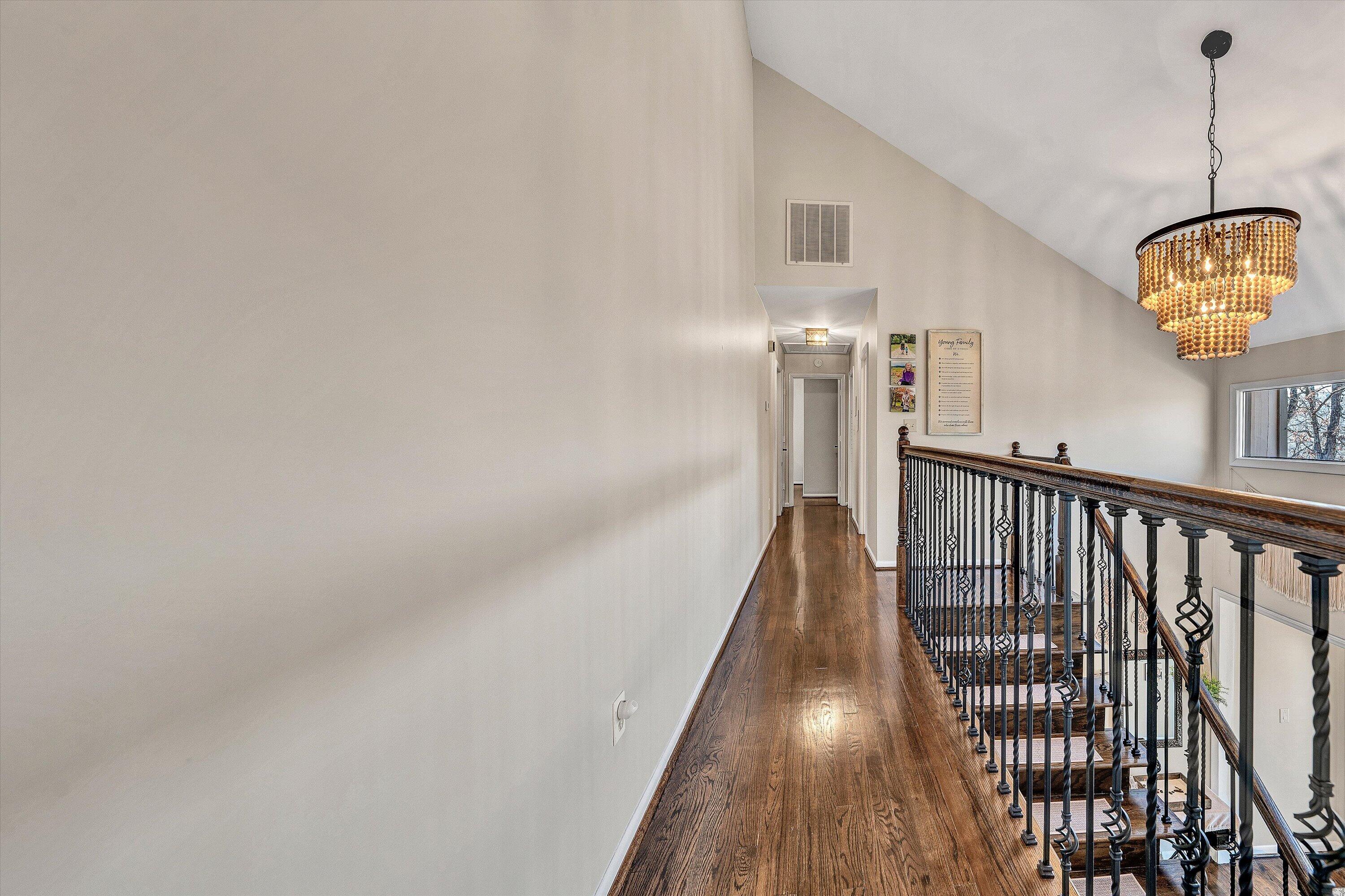5157 Remington Road Roanoke, VA 24018 - Photo 27 of 63 a view of a hallway with wooden floor and staircase