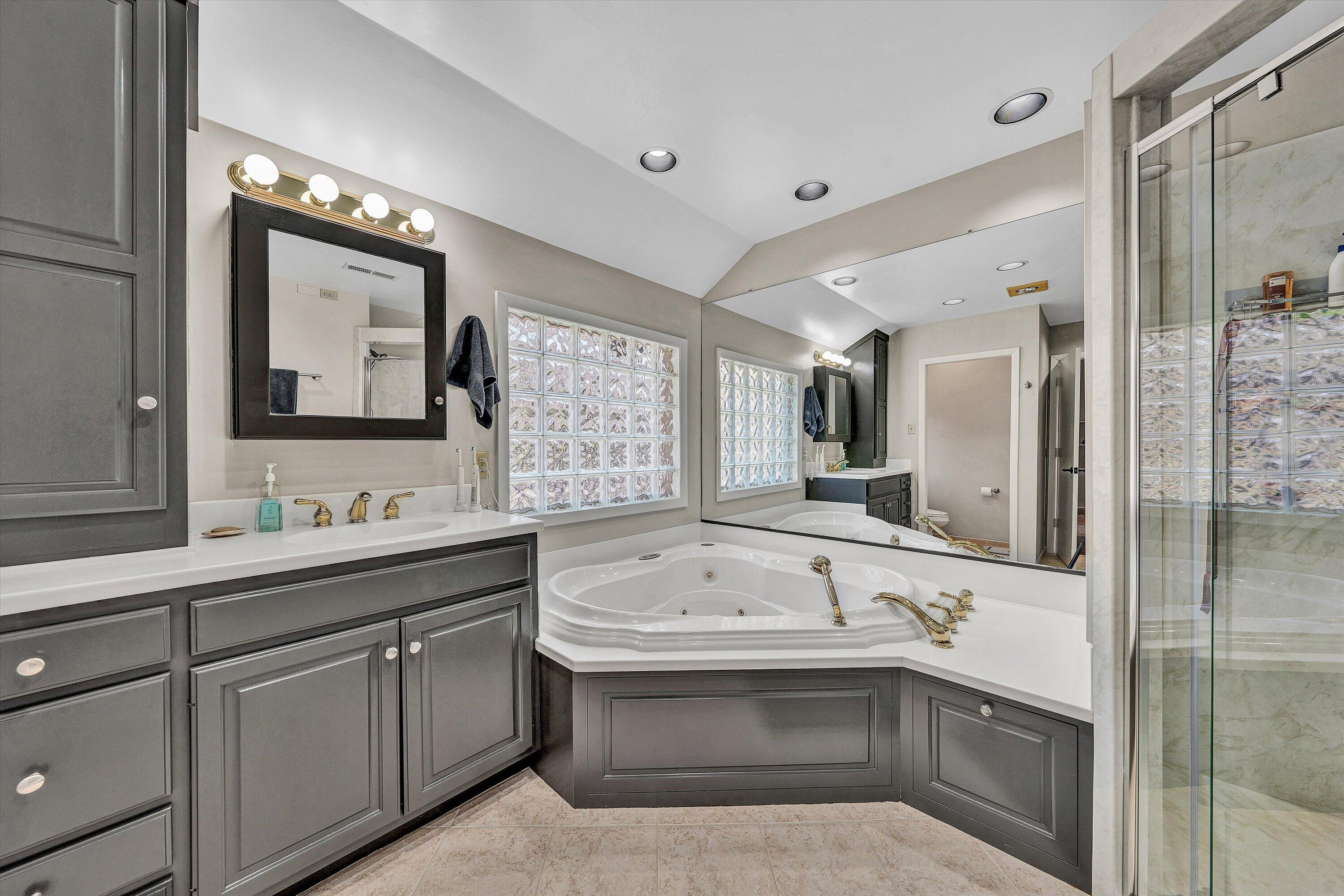 5157 Remington Road Roanoke, VA 24018 - Photo 30 of 63 a bathroom with a tub sink and mirror