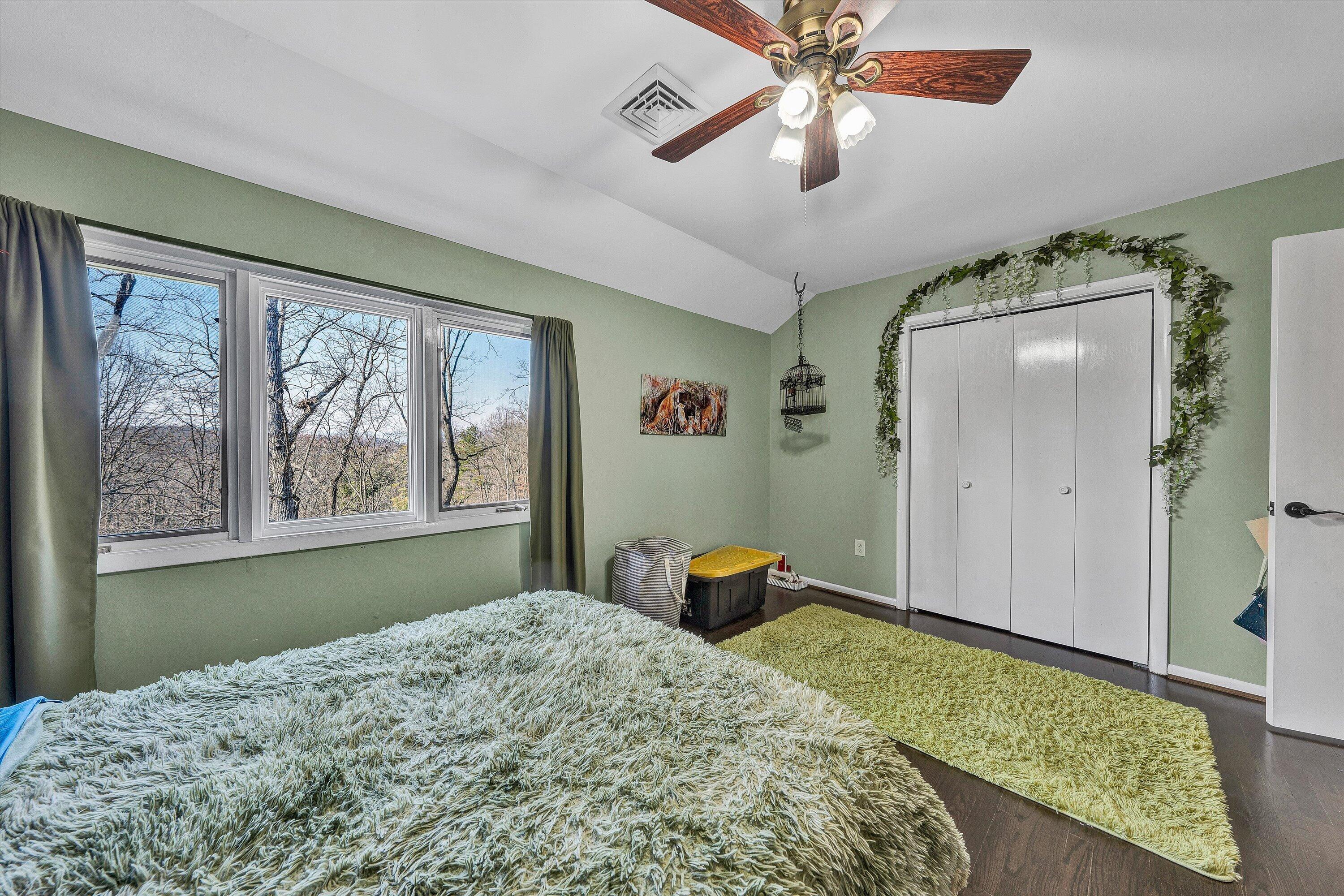 5157 Remington Road Roanoke, VA 24018 - Photo 34 of 63 a bedroom with a bed and a chandelier