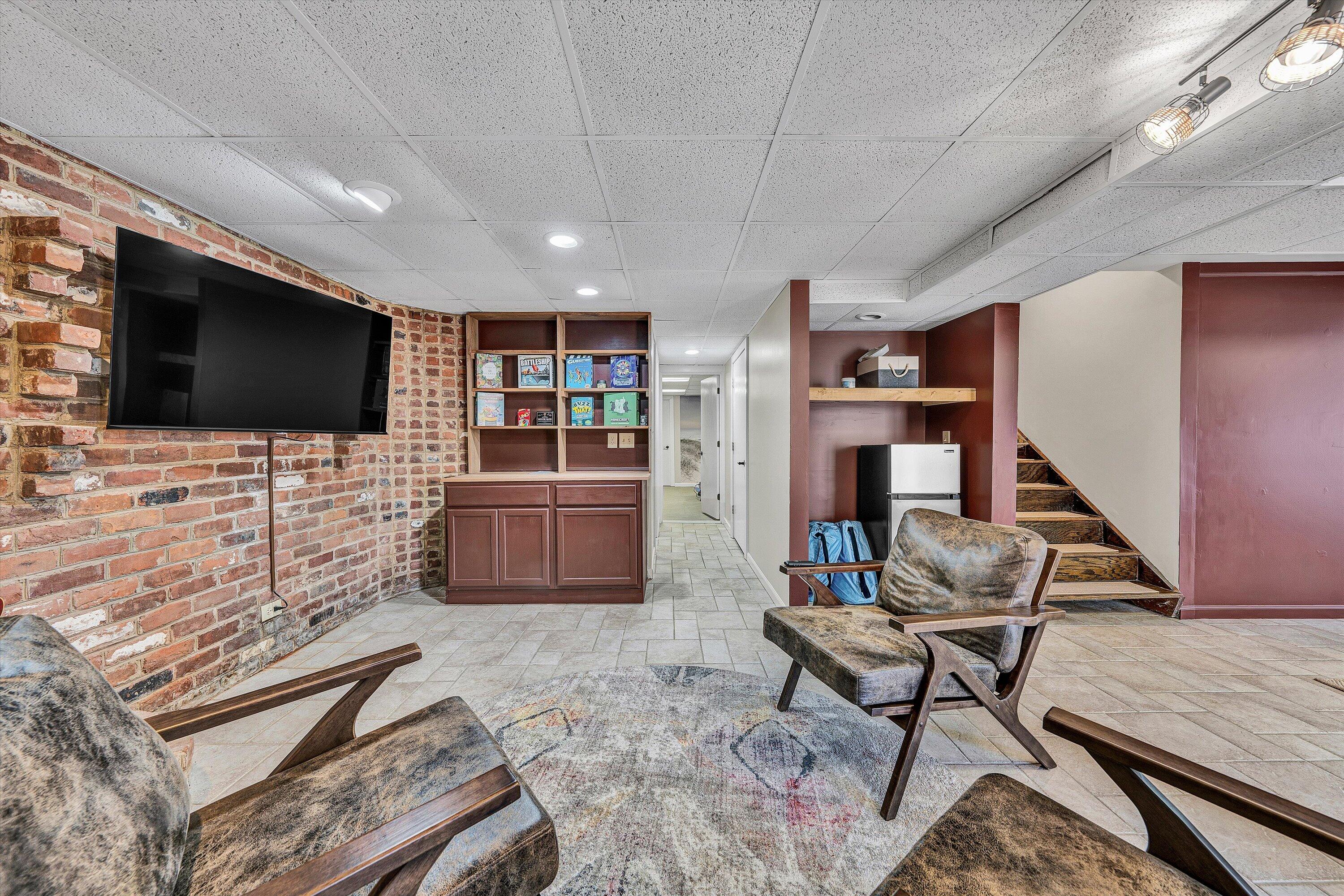5157 Remington Road Roanoke, VA 24018 - Photo 41 of 63 a living room with furniture and a flat screen tv
