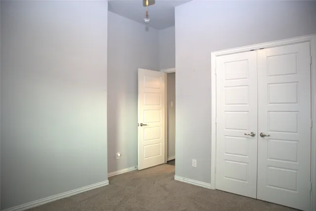 a kitchen with kitchen island a sink stainless steel appliances and cabinets