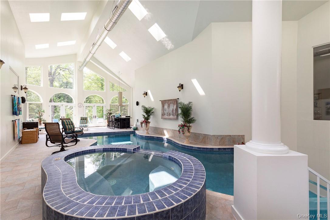 126 Old Hopewell Road Wappingers Falls, NY 12590 - Photo 3 of 34 a living room with dining table and couches with wooden floor