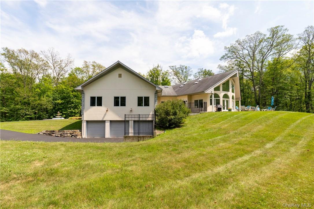 126 Old Hopewell Road Wappingers Falls, NY 12590 - Photo 31 of 34 a front view of a house with swimming pool and big trees