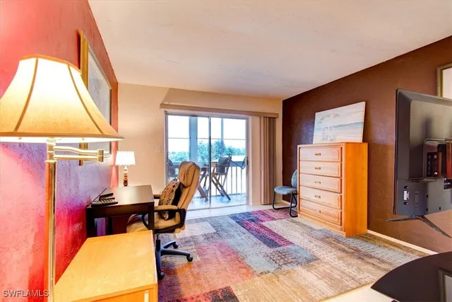 a room with furniture and a flat screen tv