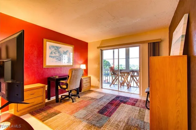 a workspace with furniture and a flat screen tv