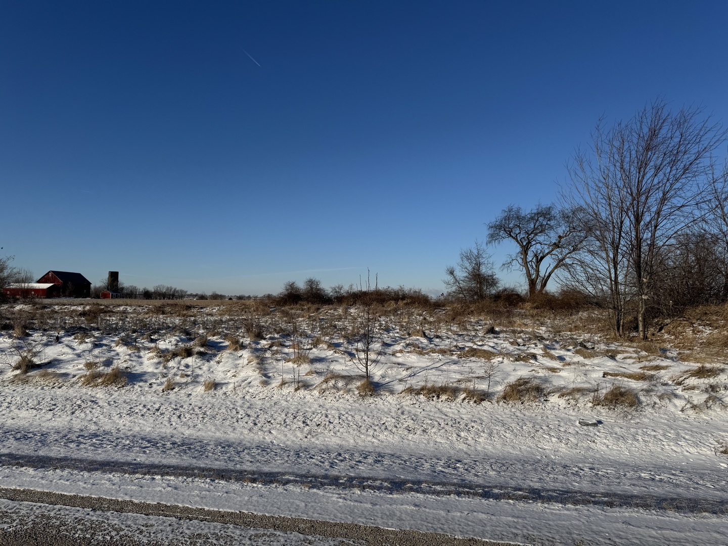 104 Kyle Lane Kirkland, IL 60146 - Photo 2 of 3 a view of a dry yard with wooden fence