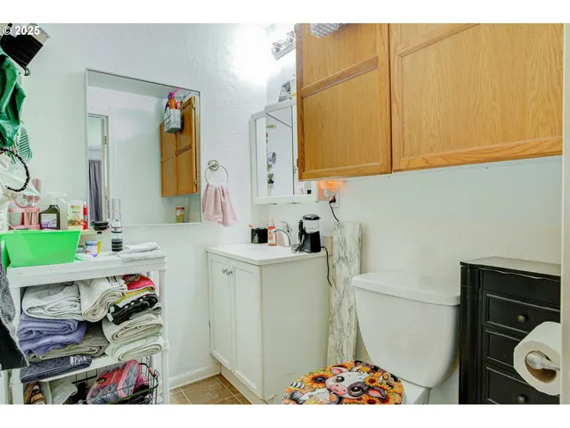 a bathroom with a sink vanity granite and a mirror
