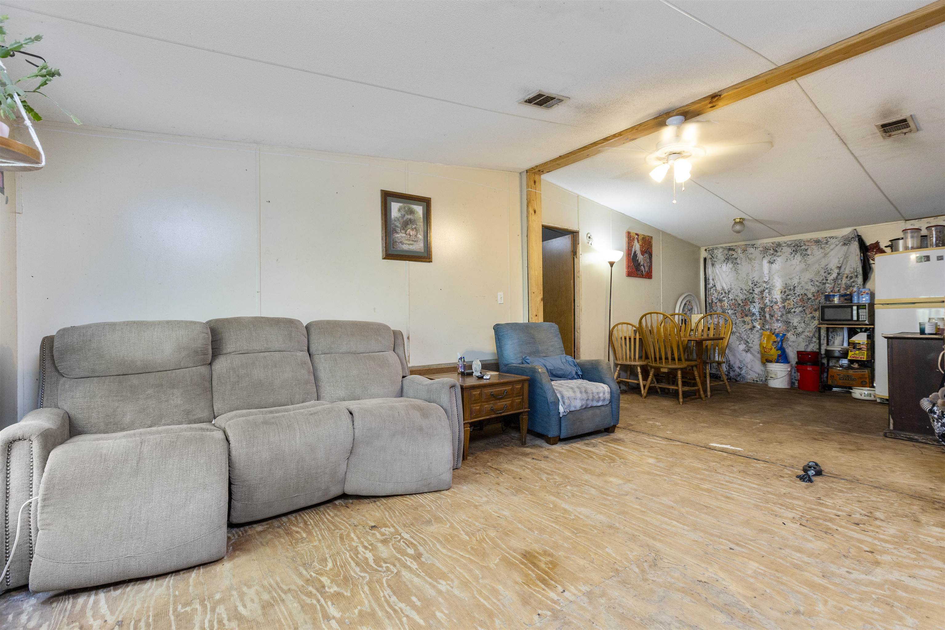 1931 Ryan Road St. Augustine, FL 32092 - Photo 27 of 34 Living area featuring wood finished floors, vaulted ceiling with beams, and ceiling fan