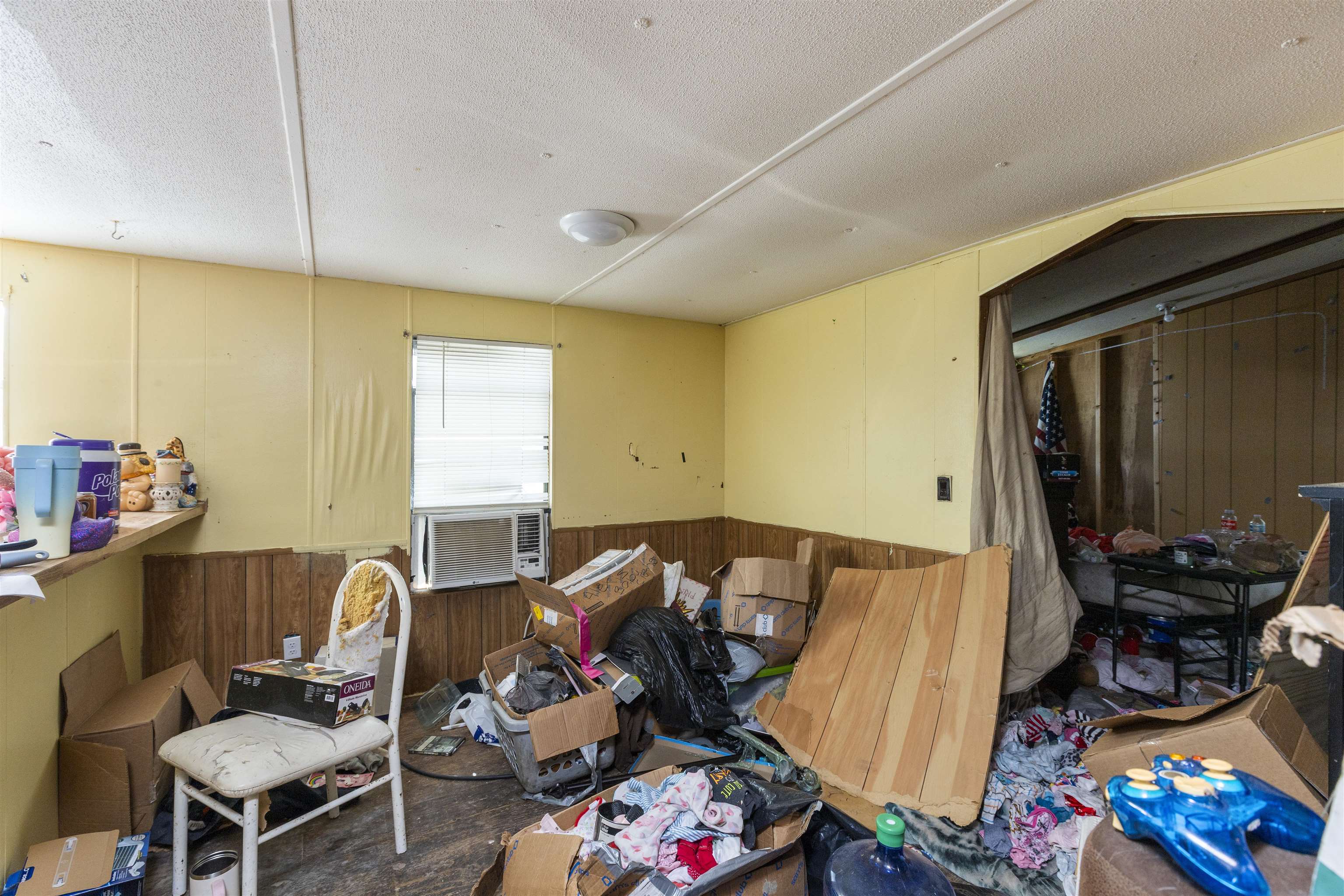 1931 Ryan Road St. Augustine, FL 32092 - Photo 32 of 34 Miscellaneous room featuring wooden walls, a wainscoted wall, and a textured ceiling