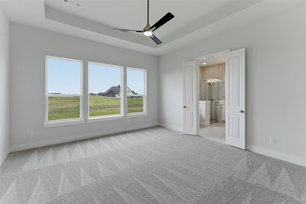2316 Quartz Street Krum, TX 76249 - Photo 18 of 29 Neutral-toned carpeting throughout