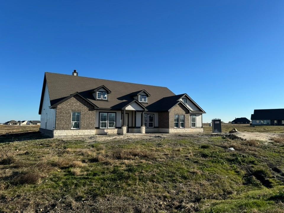 2316 Quartz Street Krum, TX 76249 - Photo 2 of 12 a big house with a big yard and large trees