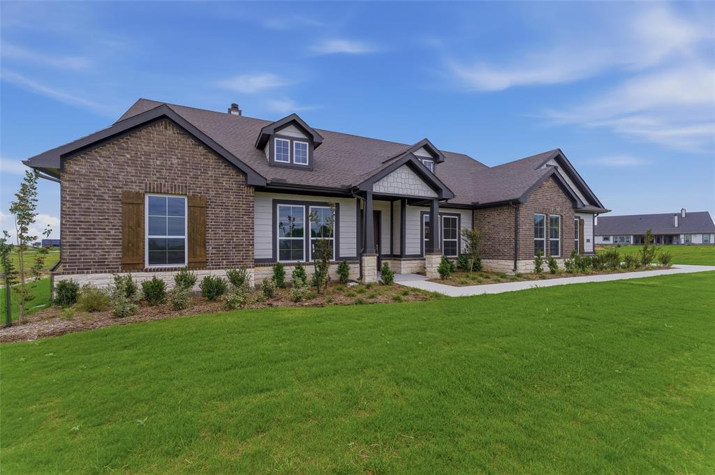 2316 Quartz Street Krum, TX 76249 - Photo 3 of 29 Modern brick and siding exterior with dark trim accents