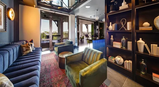 a living room with furniture and a lamp