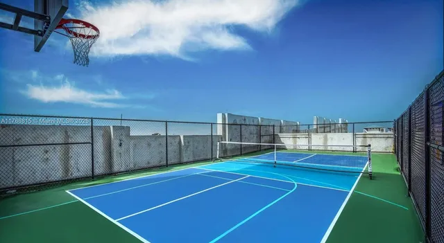 a living room with furniture a fireplace and a chandelier