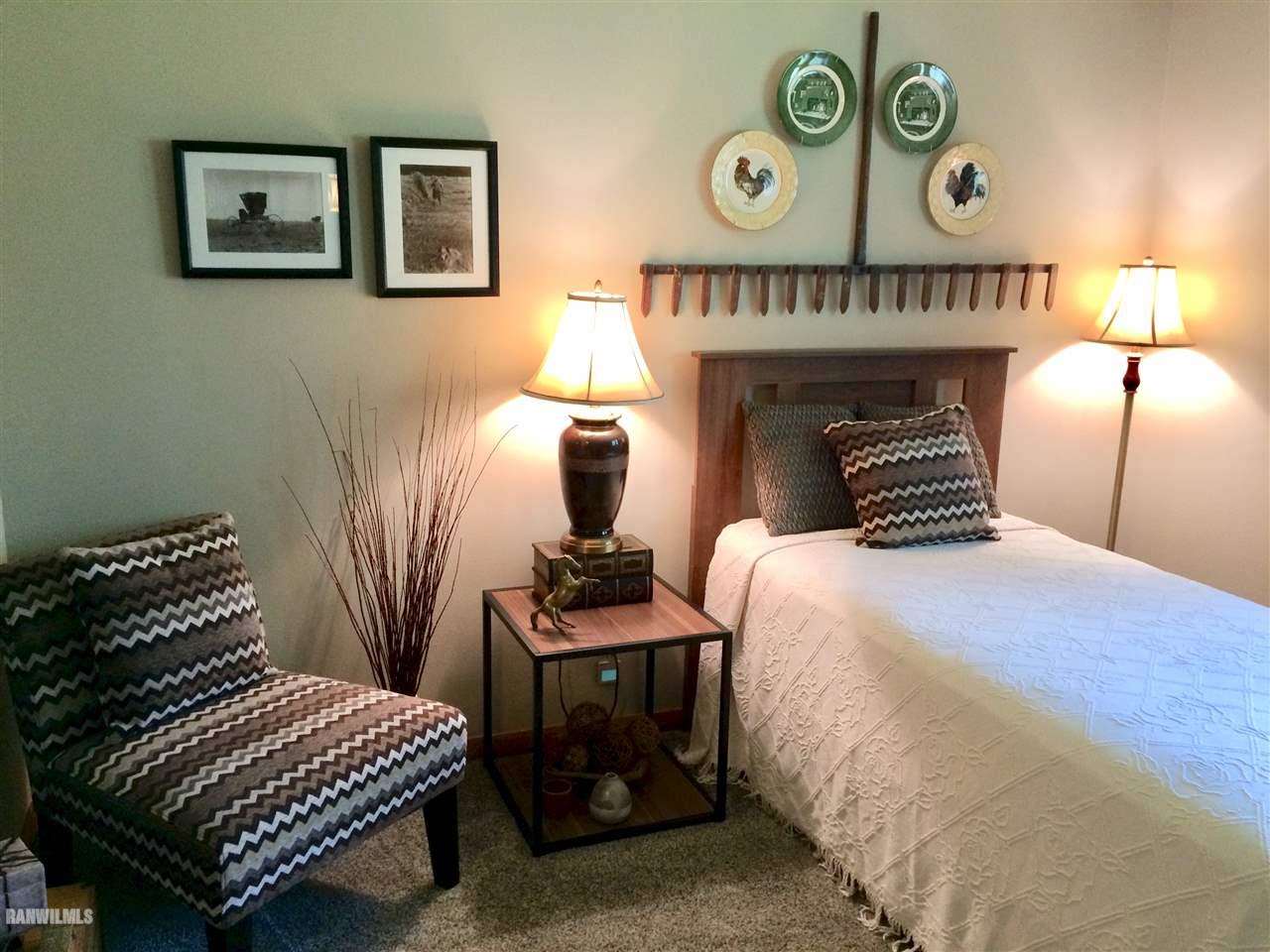 517 South Ridge Street Shannon, IL 61078 - Photo 11 of 21 a bedroom with furniture and a bed