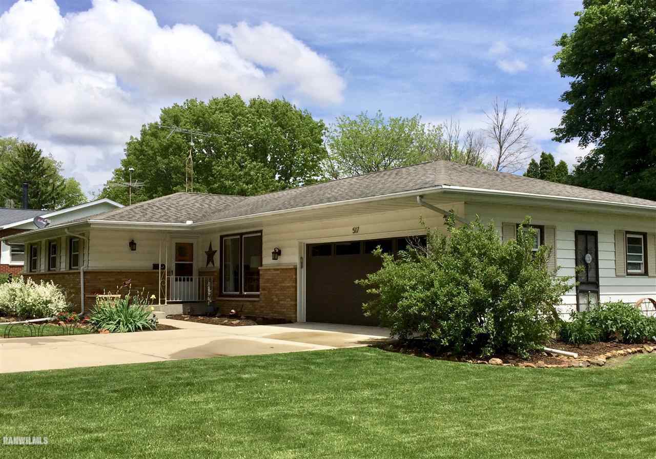 517 South Ridge Street Shannon, IL 61078 - Photo 21 of 21 a front view of a house with a yard and garage