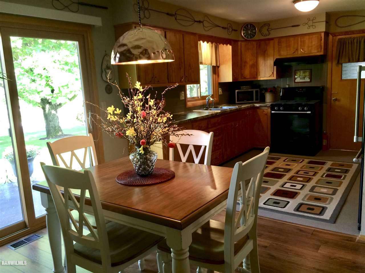 517 South Ridge Street Shannon, IL 61078 - Photo 5 of 21 a view of a dining room with furniture and a fireplace