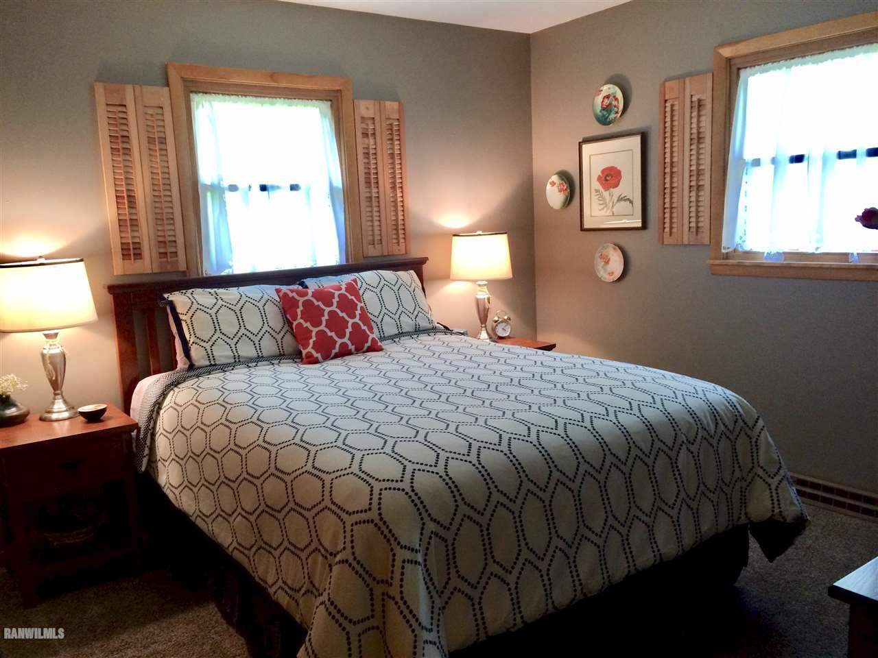 517 South Ridge Street Shannon, IL 61078 - Photo 8 of 21 a bedroom with a bed and window with lamp