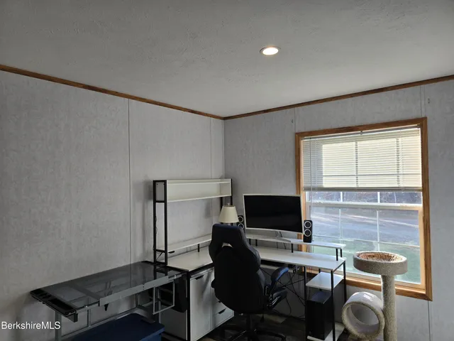 a view of a workspace with furniture