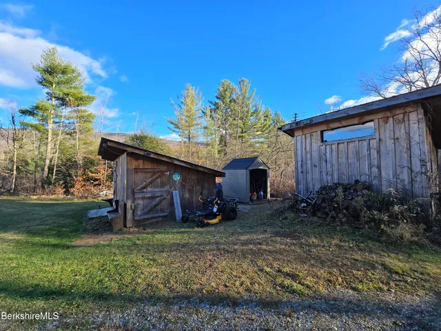 a wooden bench sitting in front of a house
