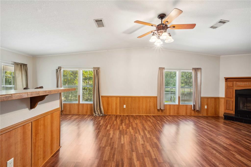 3319 Fox Ridge Boulevard Wesley Chapel, FL 33543 - Photo 12 of 50 wooden floor in an empty room with a window