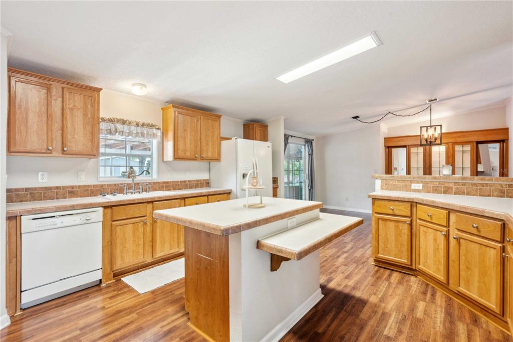 3319 Fox Ridge Boulevard Wesley Chapel, FL 33543 - Photo 17 of 50 a kitchen with stainless steel appliances granite countertop a sink stove and refrigerator