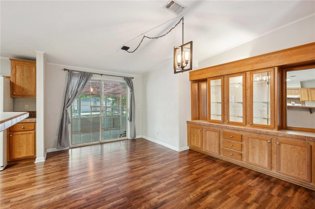 3319 Fox Ridge Boulevard Wesley Chapel, FL 33543 - Photo 21 of 50 a view of an empty room with wooden floor and a window