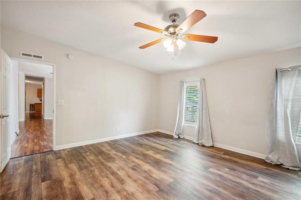 3319 Fox Ridge Boulevard Wesley Chapel, FL 33543 - Photo 24 of 50 wooden floor in an empty room with a window