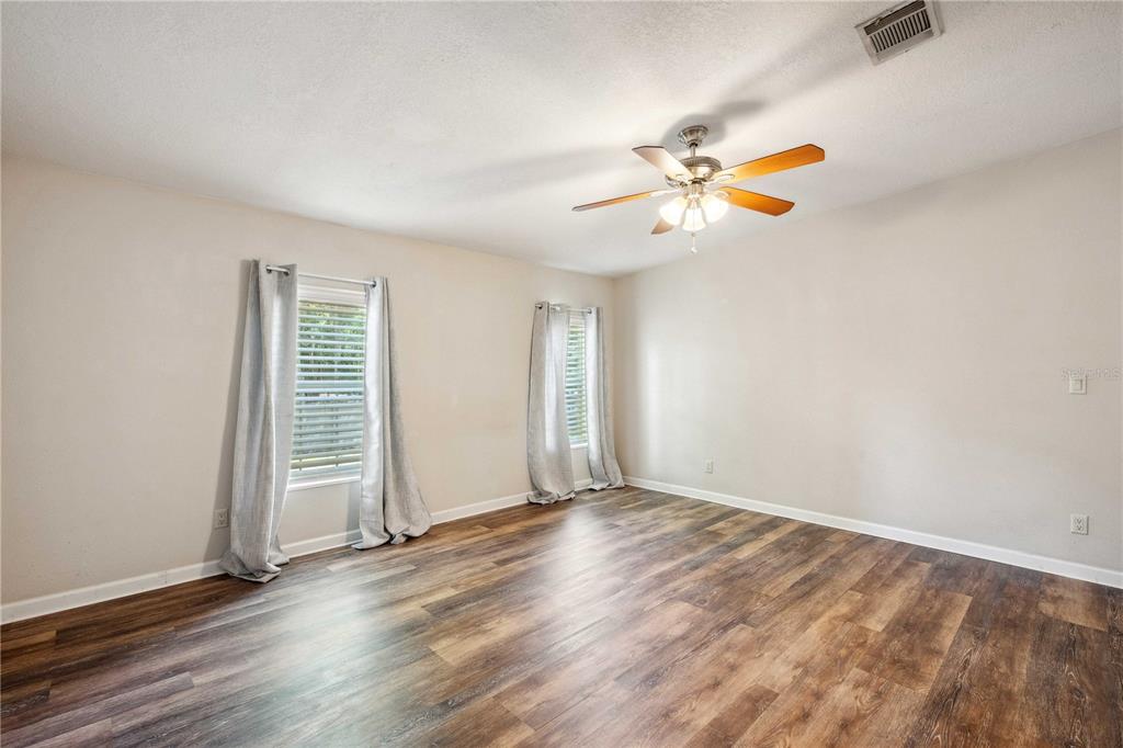 3319 Fox Ridge Boulevard Wesley Chapel, FL 33543 - Photo 26 of 50 wooden floor in an empty room with a window
