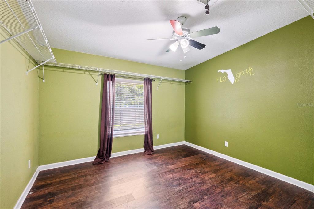 3319 Fox Ridge Boulevard Wesley Chapel, FL 33543 - Photo 28 of 50 wooden floor in an empty room with a window