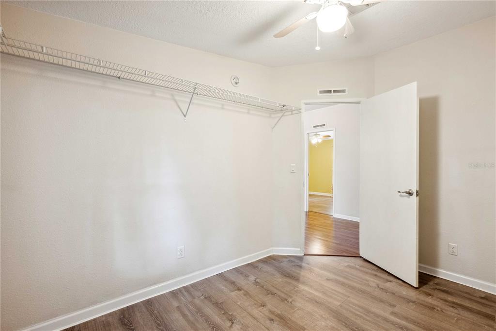 3319 Fox Ridge Boulevard Wesley Chapel, FL 33543 - Photo 30 of 50 a view of an empty room with wooden floor and a window