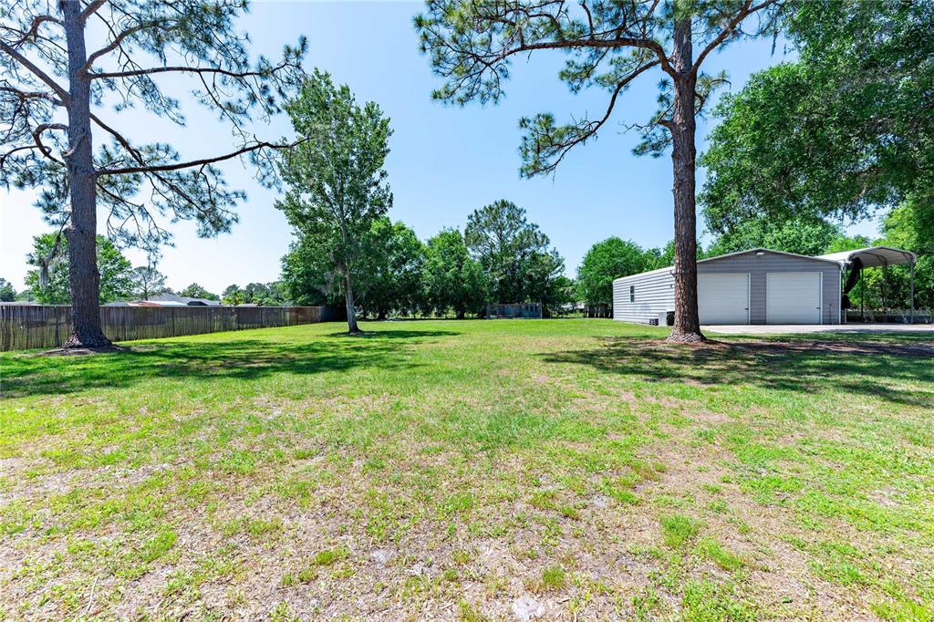 3319 Fox Ridge Boulevard Wesley Chapel, FL 33543 - Photo 3 of 50 a view of a house with a yard